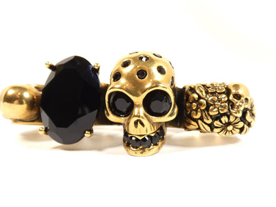 Alexander McQueen Skull Knuckle Ring in Gold and Black Ring Alexander McQueen